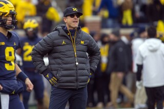 Michigan's Jim Harbaugh says he would take less salary if it meant